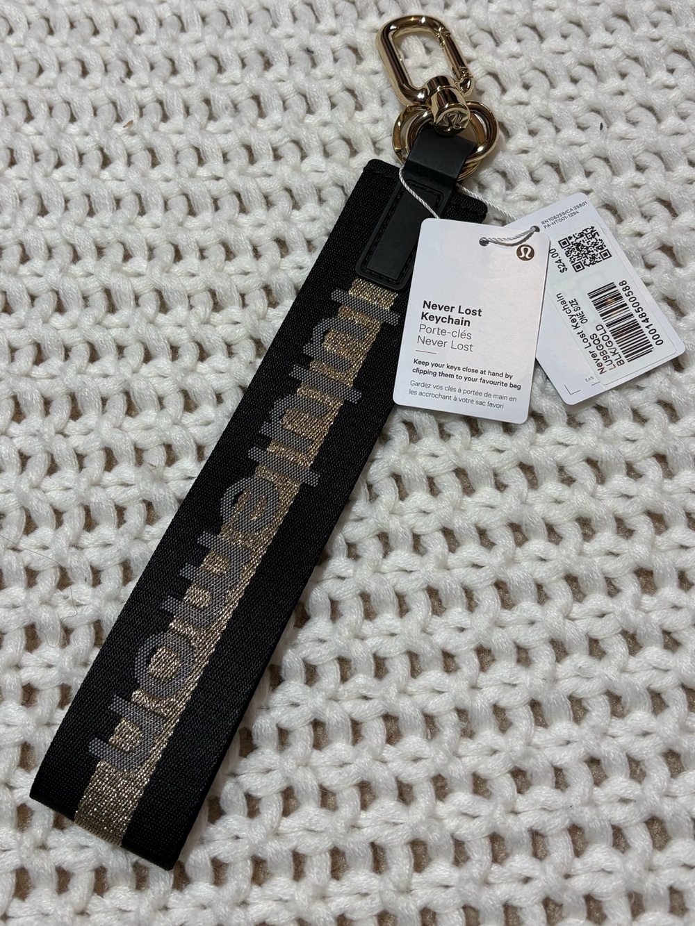 NWT lululemon black & gold never lost keychain
